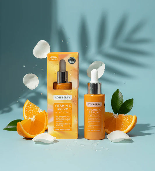 Rose Berry Vitamin C Serum bottle and packaging with oranges